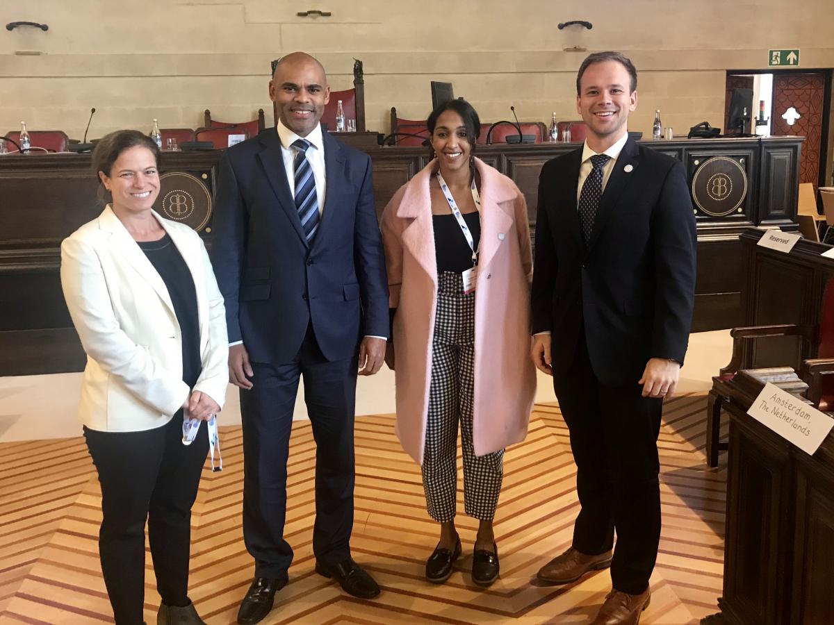 Rebecca Katz, Mayor Marvin Rees, Roeann Osman, and Matt Boyce pose at the Global Parliament of Mayors 2018 Annual Summit